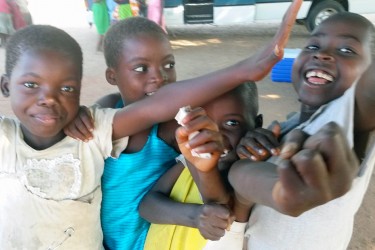 Malawi children pose for the camera on a recent international build trip filled with Chicago volunteers
