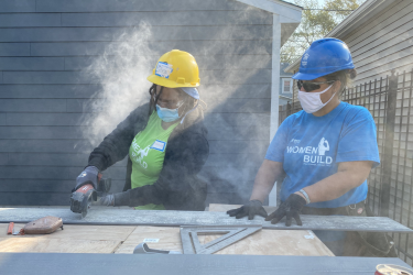Women Builder Cutting Siding at Women Build 2020