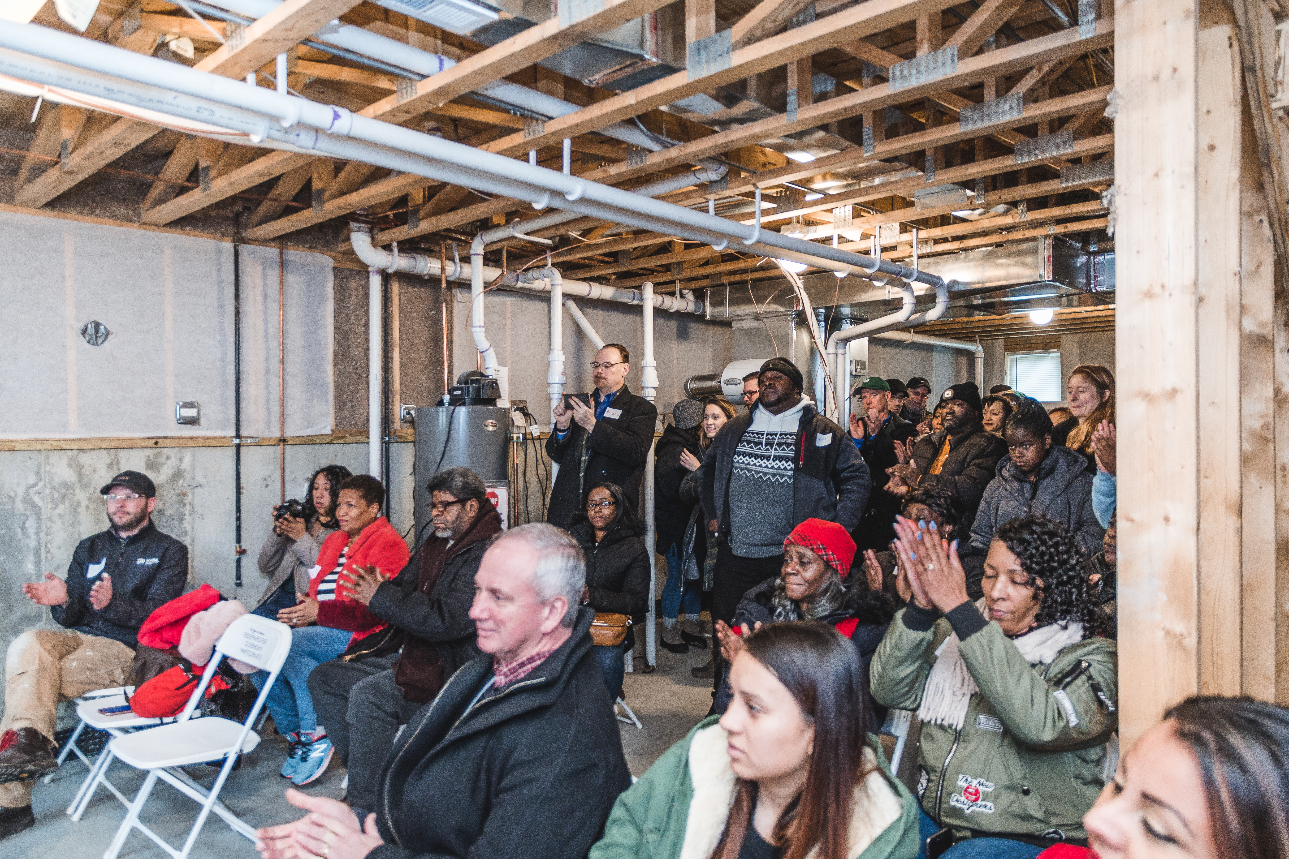 Loved ones gathered in a basements at a Dedication