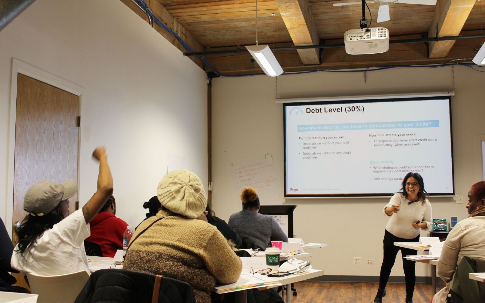 Teacher enthusiastically pointing at student raising hand