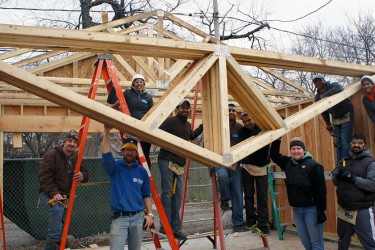 Group of friends on site building in memory of a friend