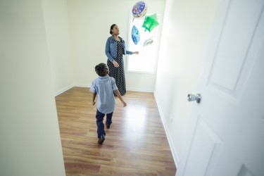 Mother and son enjoy the space available to them in their new Habitat Chicago home