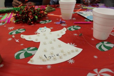 Christmas snow angel craft created by a child at the West Pullman Tree Lighting celebration