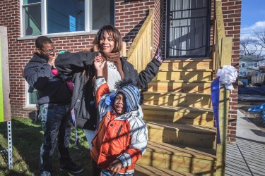 Aphriditie and family celebrate cutting the ribbon on their new, affordable Habitat Chicago home