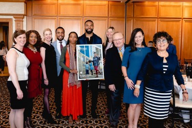 Matt Forte and Habitat Chicago homeowner, Shelonda, pose with Benefit Breakfast guets