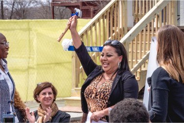 Homebuyer receiving gift at home dedication