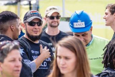 Focus on staff members in crowd of people