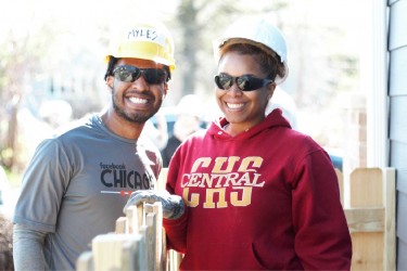 Two volunteers enjoying their day on the Habitat Chicago build site