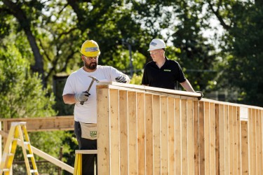 Volunteer hammering at Habitat build site
