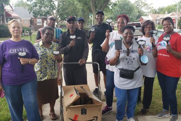 Community Members Posing with their Solar Lawn Light Project