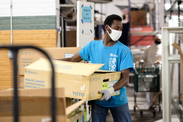 Volunteer Moving Boxes at ReStore