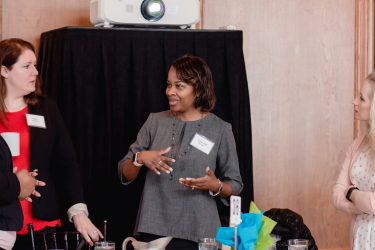 Attendees conversing at a Habitat Chicago fundraising event