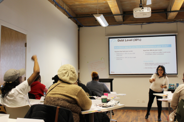 Volunteer Instructor Calling on Student During Homeownership Education Class