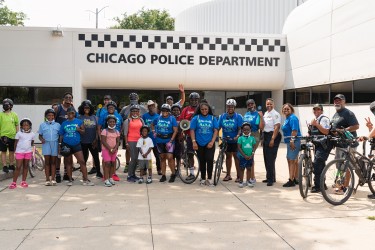 Community members gather for a picture after their bike ride for safety event 