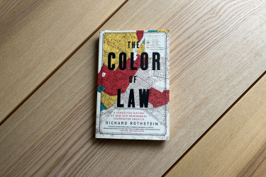 The Color of Law book on a wooden table