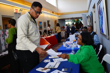 Person handing out a flyer at an event