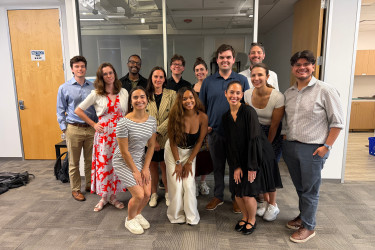 Group of young professionals smiling in an office building
